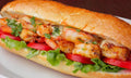 Shrimp sandwich with fries from Nour's Cuisine