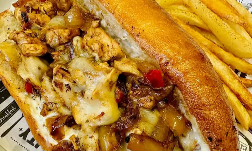 Chicken Philly sandwich with fries from Nour's Cuisine