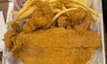 Catfish fillets and jumbo crispy shrimp with fries from Nour's Cuisine