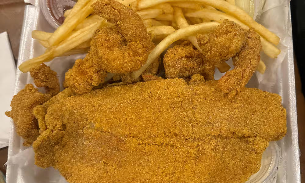 Catfish fillets and jumbo crispy shrimp with fries from Nour's Cuisine