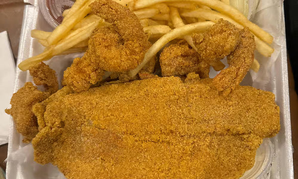 Catfish fillets and jumbo crispy shrimp with fries from Nour's Cuisine